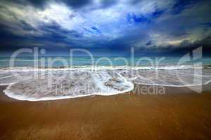 Sea beach and storm clouds