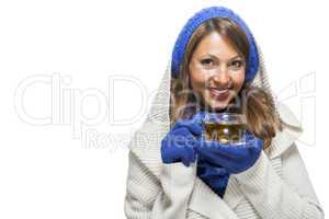 Fashionable young woman sipping hot tea