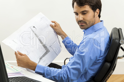 Young man reading written agreements for work