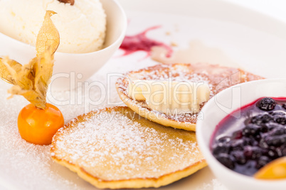 tasty sweet pancakes with vanilla icecream and topping