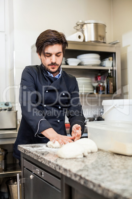 Chef tossing dough while making pastries