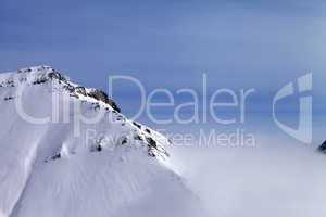 Snowy rocks in fog