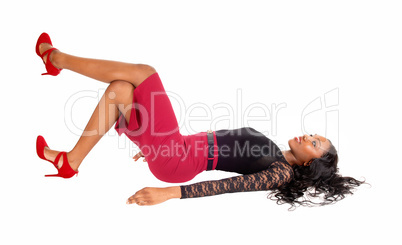 Black woman lying on floor.