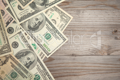 Bank notes on wooden background, vintage tone.