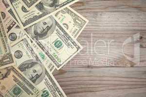 Bank notes on wooden background, vintage tone.