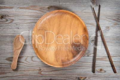 Empty plate, spoon and sushi chopsticks