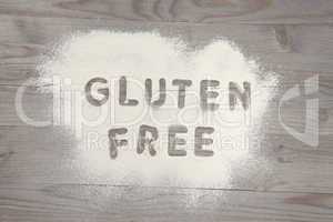 Word gluten free written in white flour