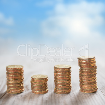 Stack coins with sky background