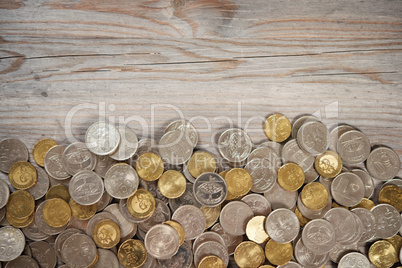 Top view coins on old wooden desk