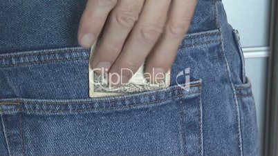 man nonchalantly hiding money in your back pocket