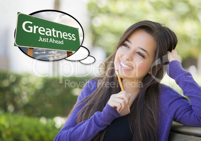 Young Woman with Thought Bubble of Greatness Green Road Sign