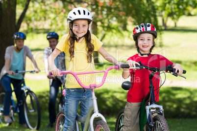 Happy family on their bike at the park