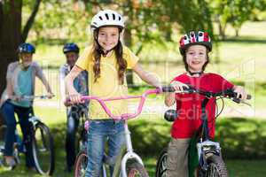 Happy family on their bike at the park