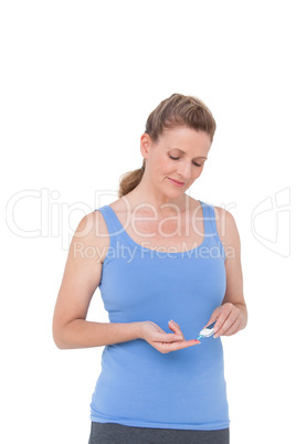 Woman using diabetes blood glucose moniter