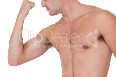 Fit shirtless man flexing his bicep