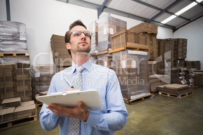 Warehouse manager checking his inventory