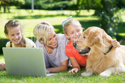 Happy family looking at their dog