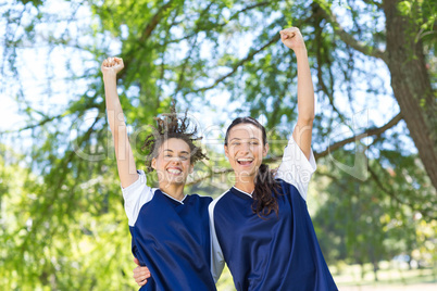 Pretty football players cheering at camera