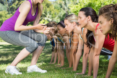 Fitness group planking in park