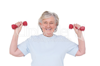 Senior woman lifting hand weights