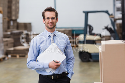 Portrait of manager holding clipboard