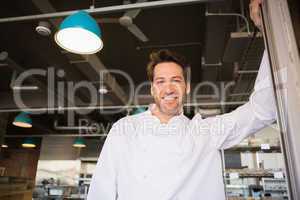 Portrait of a smiling baker standing