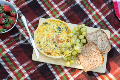 Overhead of lunch on picnic blanket