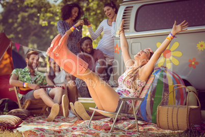 Carefree hipster having fun on campsite