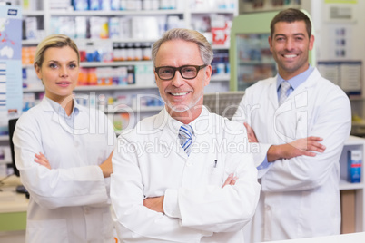 Team of pharmacists smiling at camera