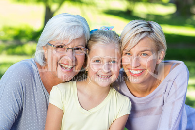 Smiling family looking at the camera