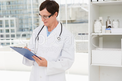 Veterinarian holding clipboard