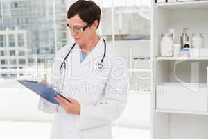 Veterinarian holding clipboard