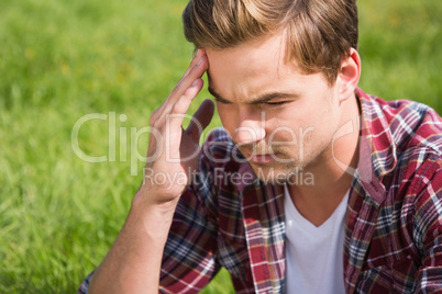 Handsome hipster getting a headache