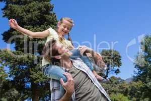 Father and daughter having fun in the park