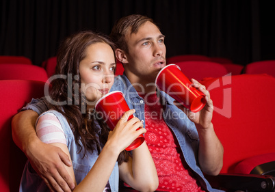 Young couple watching a film