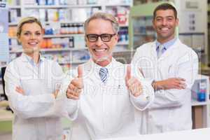 Team of pharmacists smiling at camera