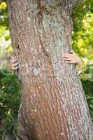 Woman hugging a tree