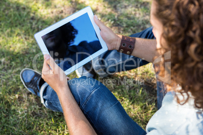 Young man using tablet in the park