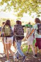 Young friends walking towards their campsite