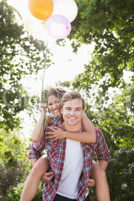 Cute couple having fun with balloons