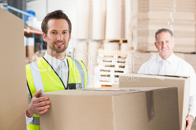 Delivery driver loading his van with boxes