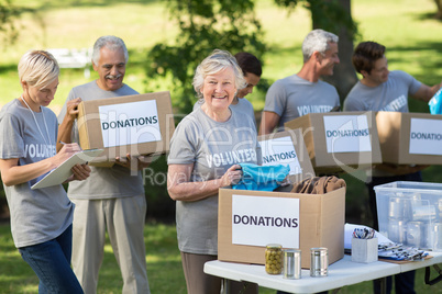 Happy family holding donations boxes