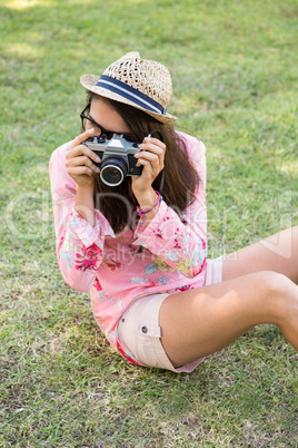 Pretty brunette with retro camera