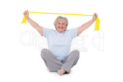 Senior woman using resistance band Senior woman using resistance band
