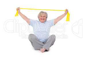 Senior woman using resistance band