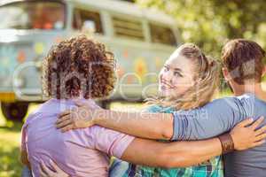 Hipster smiling at camera with friends