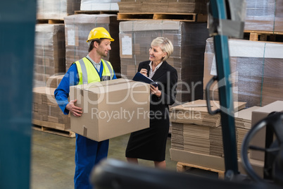 Warehouse worker and his manager working together