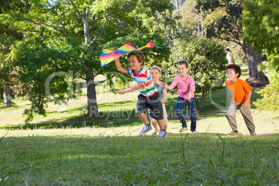 Children playing with kite in park