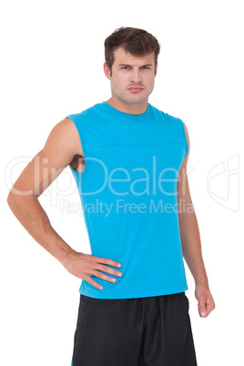 Fit man with hand on hip