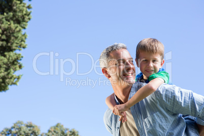 Father and son having fun in the park